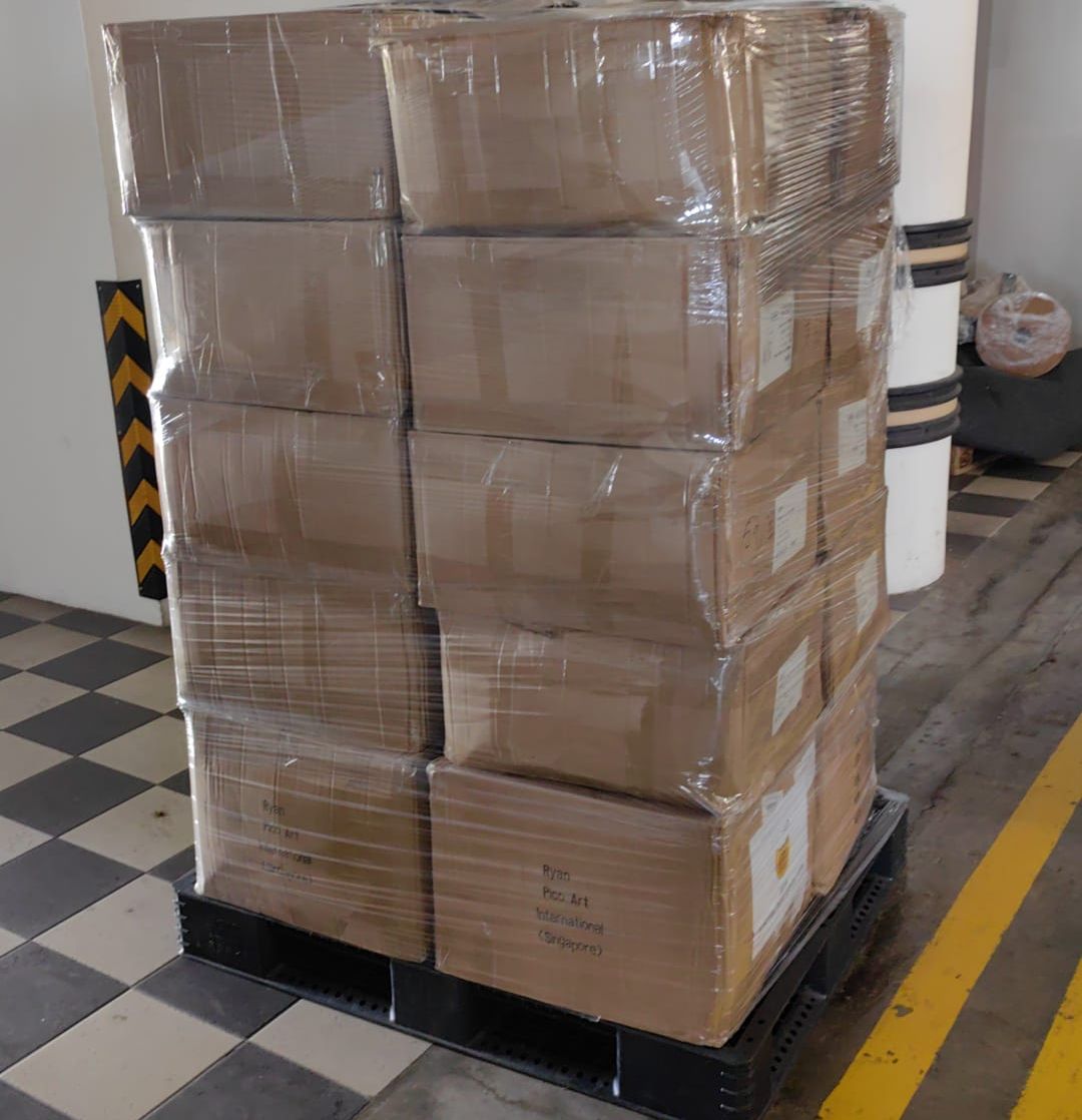 A pallet of wrapped cartons ready for an office move