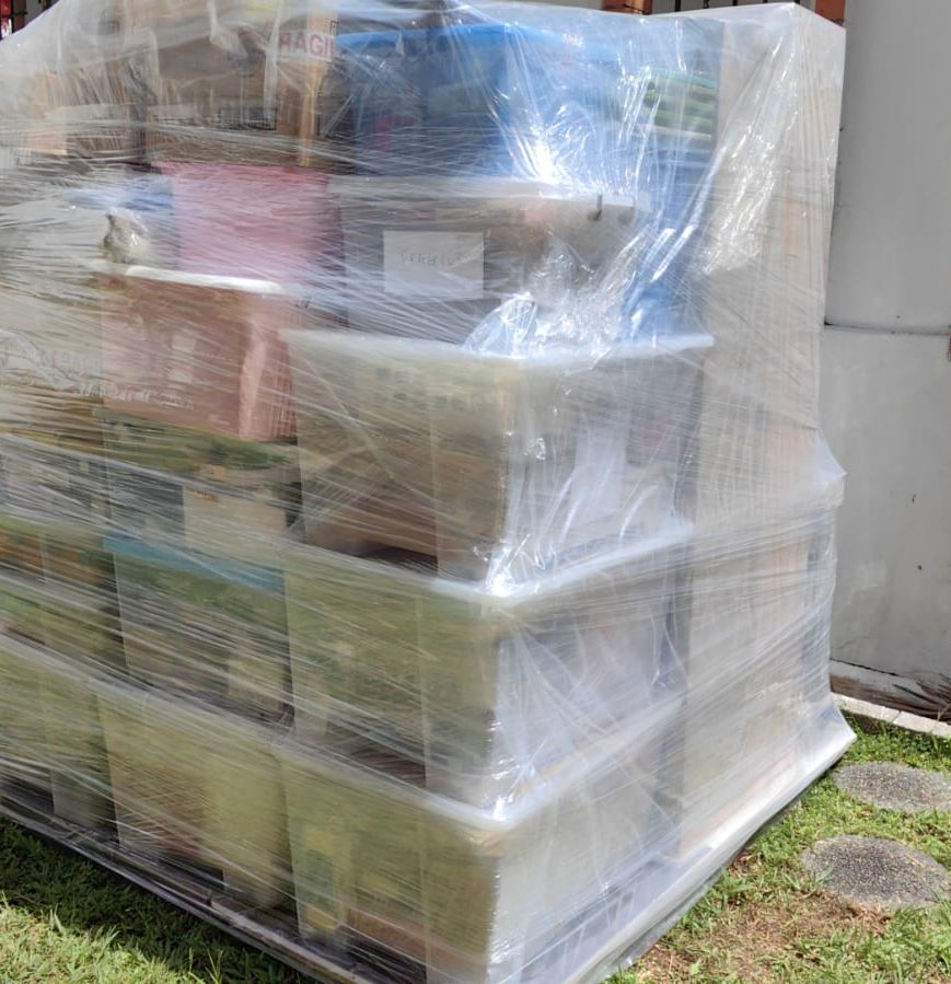 A large pallet of goods wrapped in plastic film