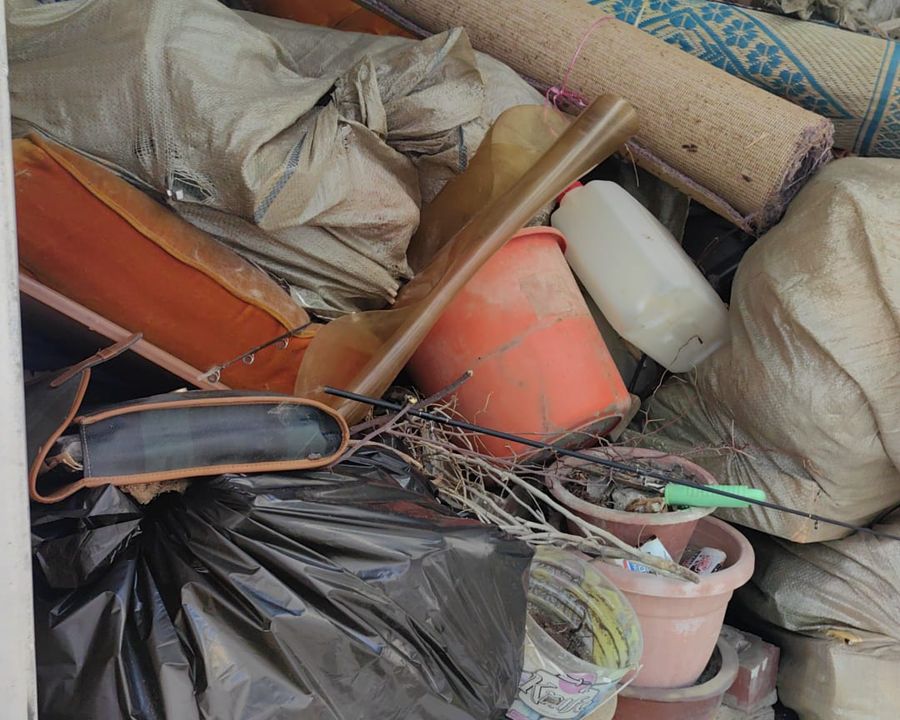 Household items loaded into the back of a lorry
