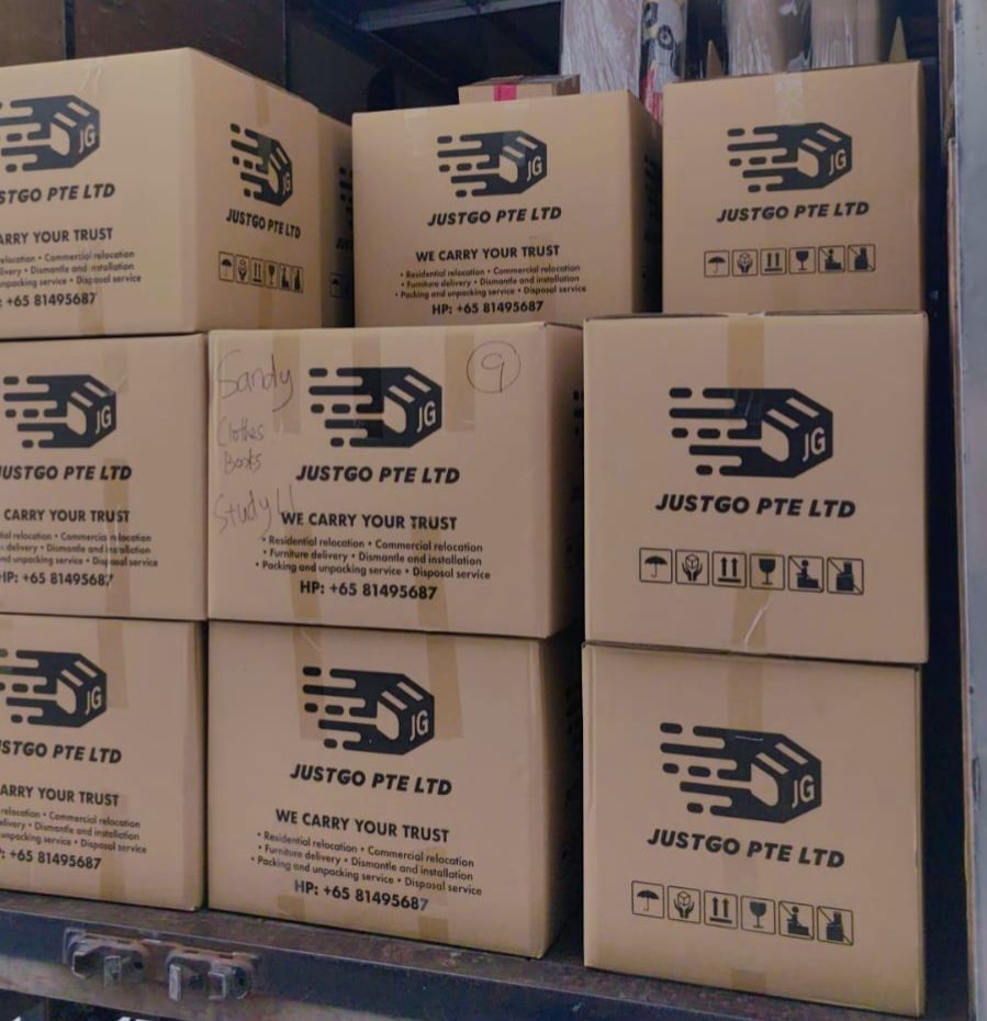 Neatly packed JustGo carton boxes loaded in a lorry