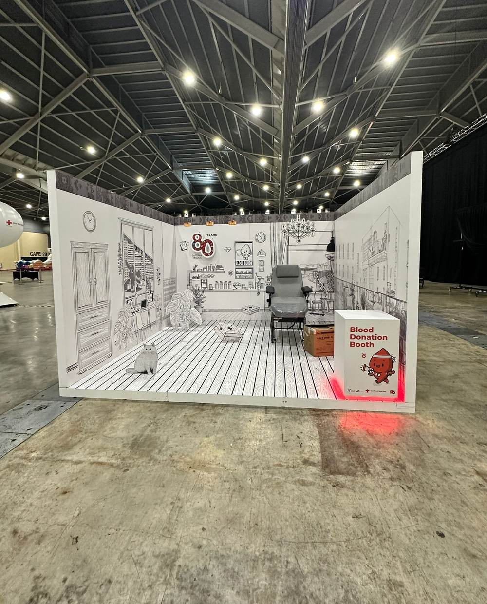A large exhibition hall with a staged booth, delivered by JustGo event support